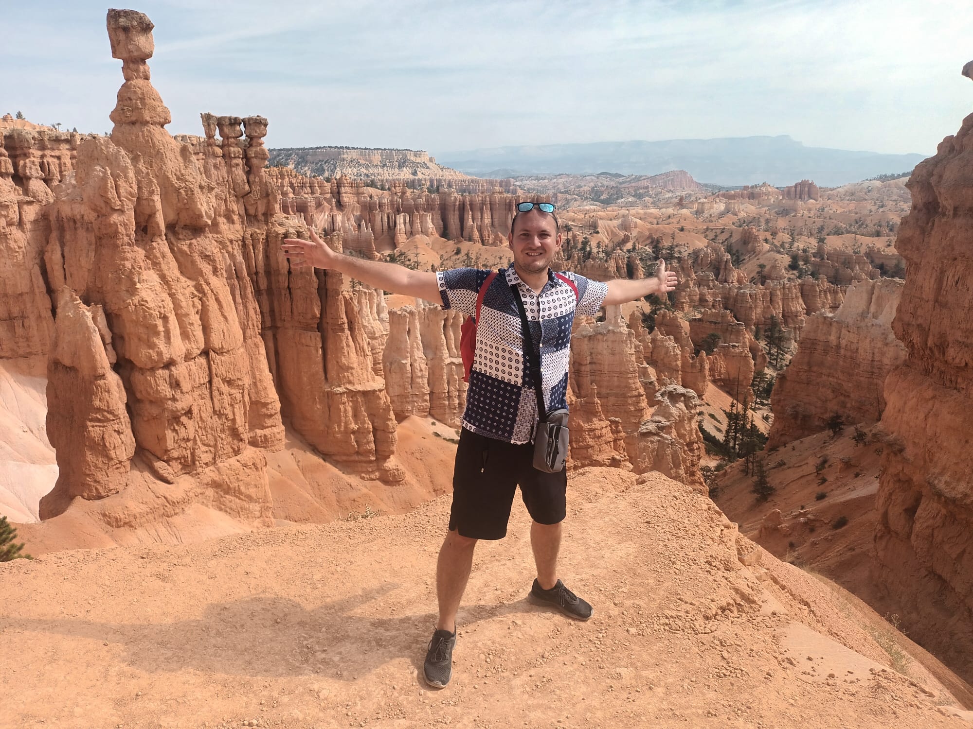 Andrija Sente standing in front of the hoodoos at Bryce Canyon National Park.